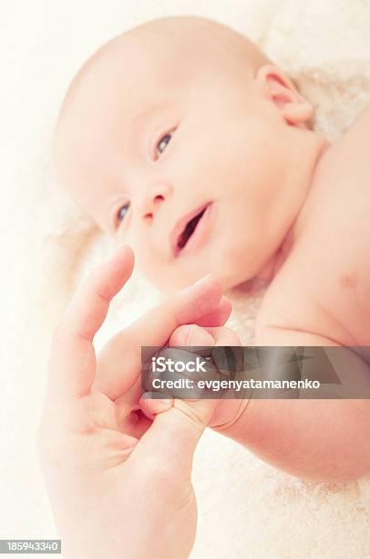 Newborn Baby Hand On The Finger Of Mother Stock Photo - Download Image Now - Baby - Human Age, Adult, Baby Girls