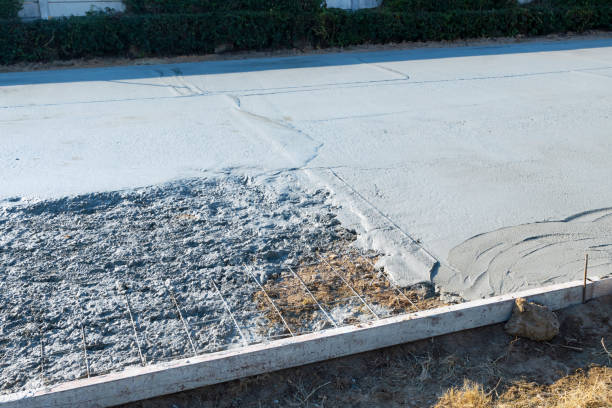istock pouring concrete floor reinforced with rebar and square frame. Lay welded wire mesh for a concrete slab.Construction site. 1859452204