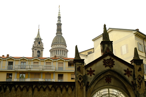 Houses in Novara with the dome of San Gaudenzio. Spiers and houses near the bell tower of the cathedral and the dome designed by Alessandro Antonelli.