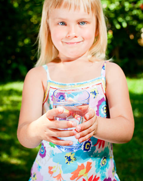 istock Child with glass of water 185947294