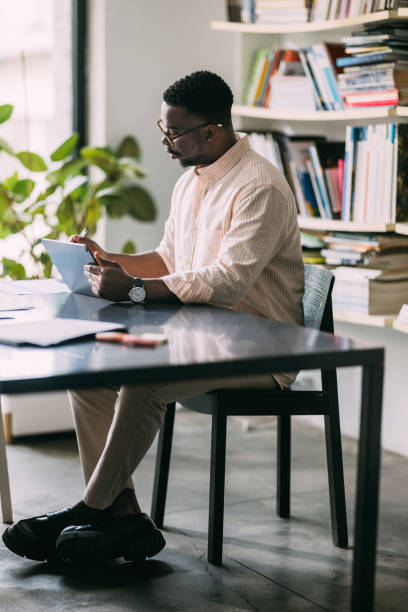 istock Digital Office: African-American Man Thriving with Tablet 1859476608