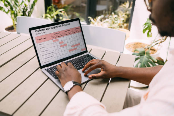 istock Inspired Connections: Anonymous African-American Man Working at Cafe 1859476623