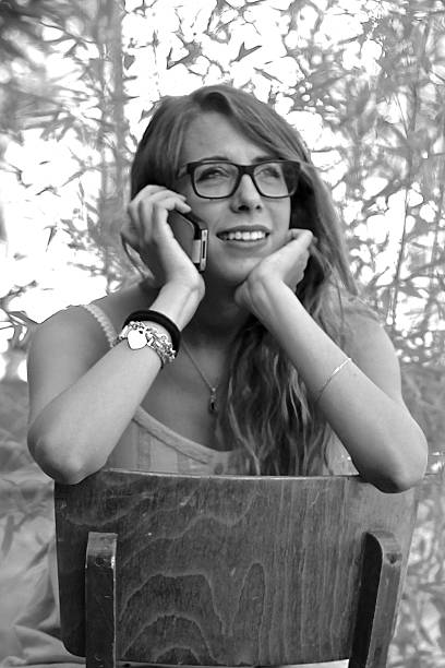 istock Young girl speaks on her mobile phone 185948084