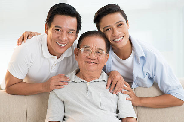 istock A happy family posing on a beige couch 185948113