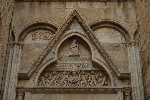 Tympanum and portal of the transept. Decorations on the stone of the cathedral of Cagliari.  Stock photos. Cagliari, Italy.