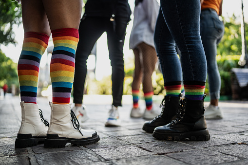 Low section of LGBTQIA people's legs outdoors