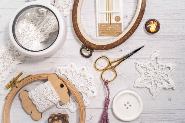 istock Accessories for hobby. Hoop snaps, scissors, threads, needles and scissors. Vintage tools for embroidery and knitting 1859531560