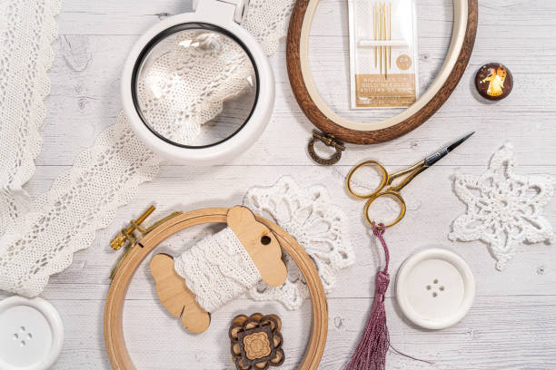 istock Accessories for hobby. Hoop snaps, scissors, threads, needles and scissors. Vintage tools for embroidery and knitting 1859532077