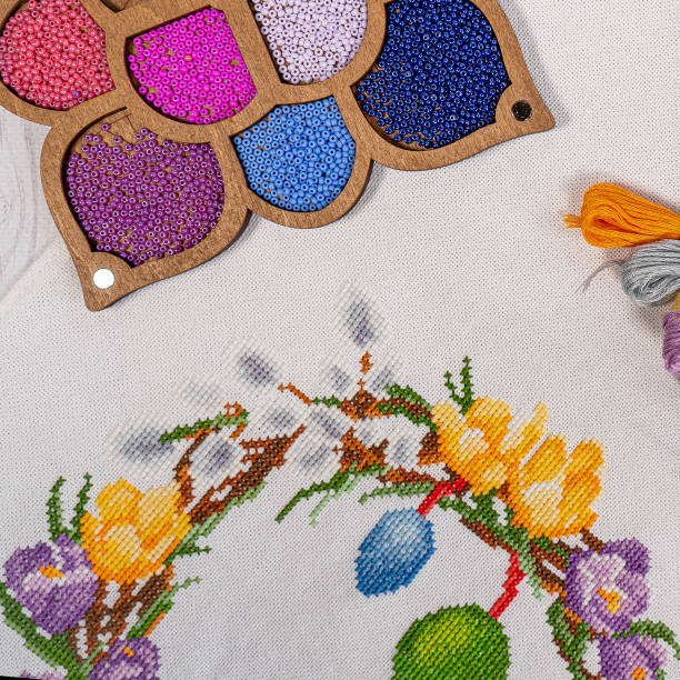 istock Fabric embroidered Easter wreath with beads of hobby thread 1859550778