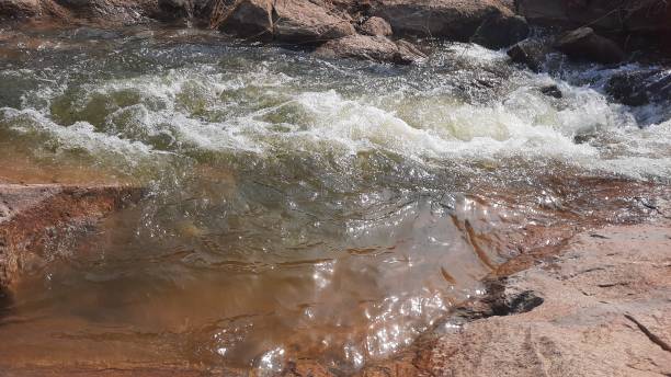 istock mountain river with rocks and water splashes on a sunny day 1859567339