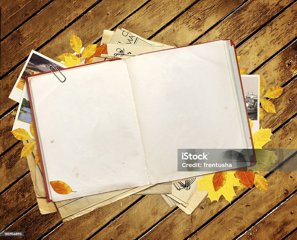 Old book and photos Old book, autumn leaves and photos. Objects over wooden planks Autumn Stock Photo