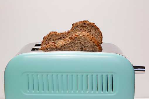 Biting pieces Whole Wheat bread sliced on white background, whole grain bread,