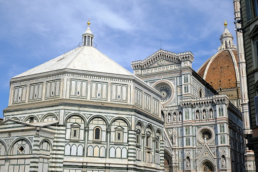 Florence, Tuscany, Italy. About 2021. Cathedral square in Florence. Santa Maria del Fiore and Giotti's bell tower with blue sky.  Video footage.