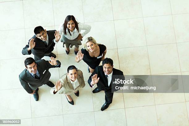 Overhead View Of Businesspeople Waving Stock Photo - Download Image Now - Aerial View, Business Person, Teamwork