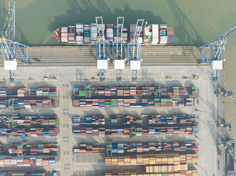 Aerial view of big grain elevators on the sea. Loading of grain on ship. Port Ukraine. Cargo ship download photo