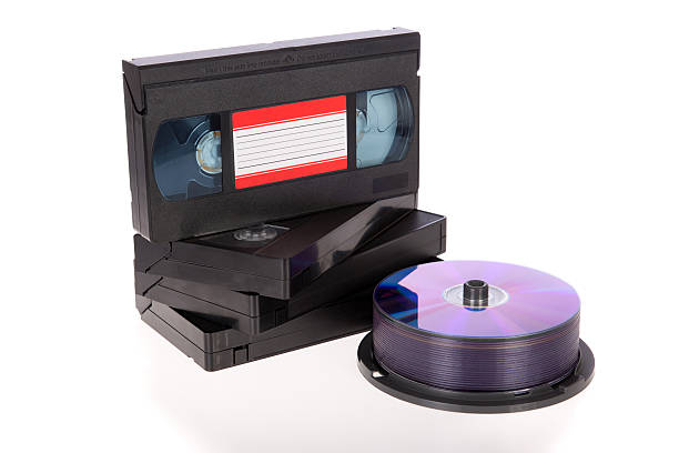 istock Video tapes with a DVD disc isolated on white 185967210