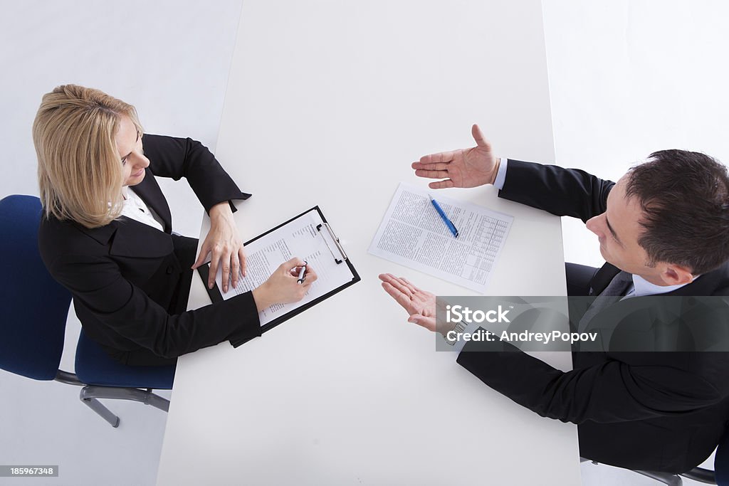 Two Businesspeople Talking With Each Other Happy Businessman And Businesswoman Discussing In Office Adult Stock Photo