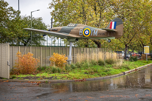 Hendon, London, England - November 4th 2023:  Restored Hurricane fighter plane put up in the public area as a advertisement for the RAF museum in Hendon