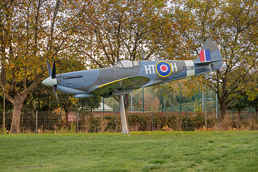 A scale model of the iconic B-17 Flying Fortress sitting on a scale model airfield. The B-17 was an American four-engined heavy bomber aircraft developed in the 1930s for the United States Army Air Corps and made by Boeing.