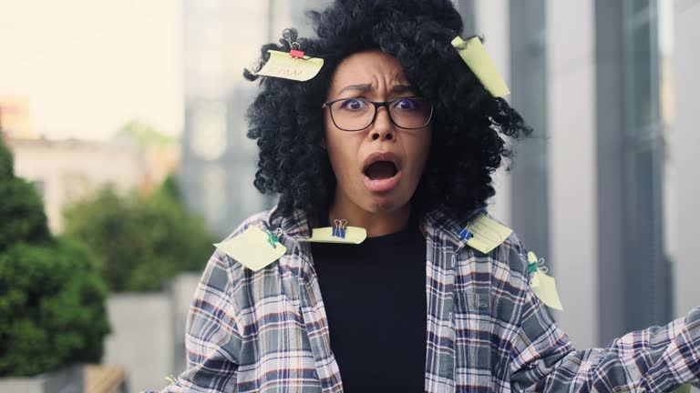 Nervous stressed young curly girl student with stickers panic asking to hurry up scream warning about deadline exam