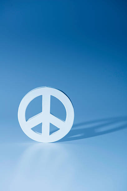 White symbol of peace on blue background.