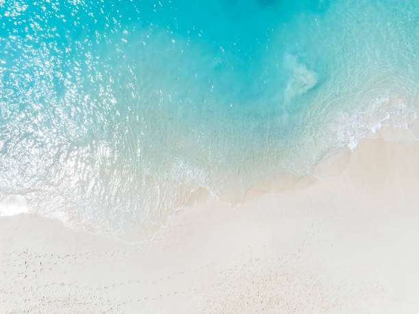 istock Beach Wave water in the Tropical summer beach with  sandy beach background 1859726704