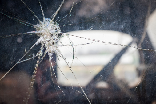 Abstract Cracked Window Glass on Antique Truck with Selective Focus.