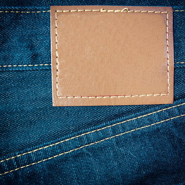 istock Leather jeans label sewed on jeans. 185973319