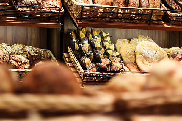 Various  bread type, pastries and bakery products on shelf stock photo