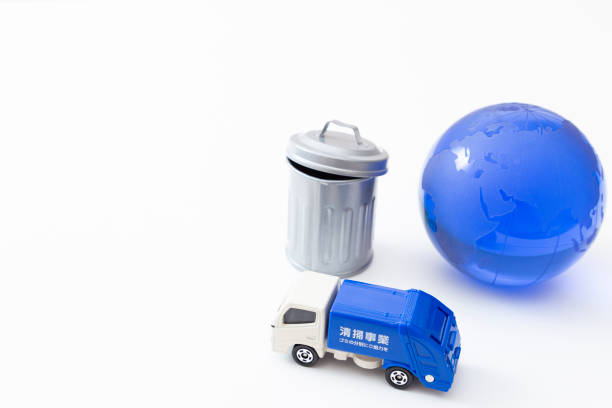 istock Garbage truck, trash can and earth. 1859768227
