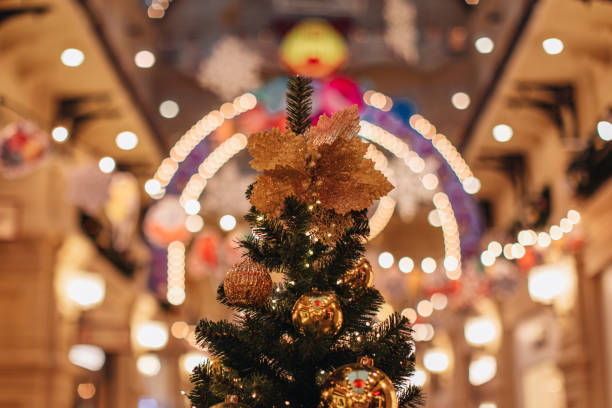 istock Festive Christmas tree, decorated with golden lights, snowflakes, beads. 1859789870