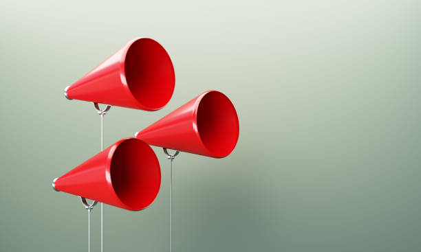 istock Red Megaphones  In Front Of Gray Wall 1859801213