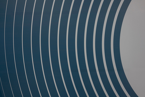 A background wall with blue and white arc-shaped stripes