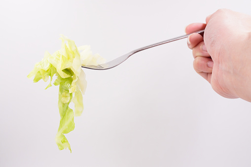 Fresh pieces of boiled green cabbage