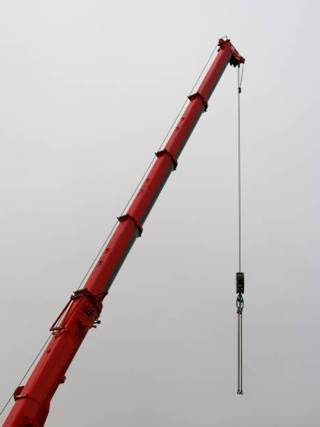 istock Telescopic crane with suspension chain on gray sky background 1859807395