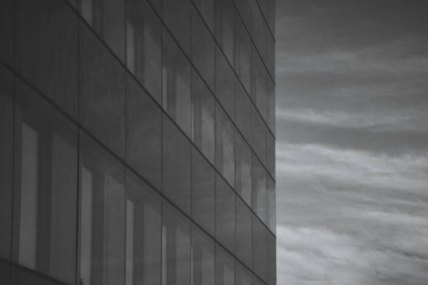 istock Low angle view of building against cloudy sky 1859809696