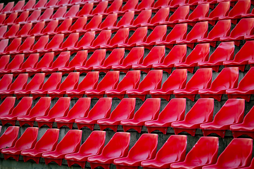 Red plastic seats in stadium