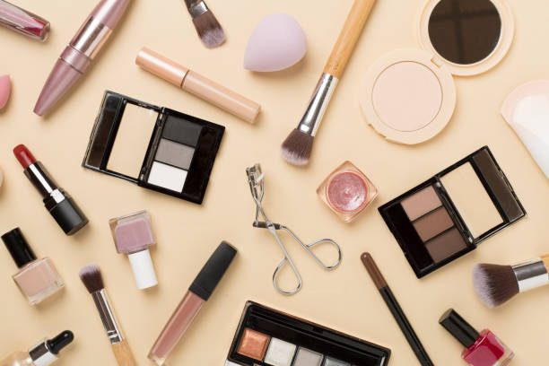 istock Flat lay with makeup products and tools on color background 1859836141