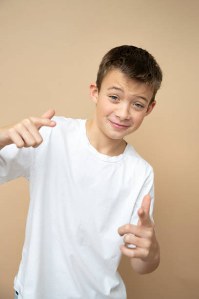 istock cool 11 years old boy in front of brown background 1859836676