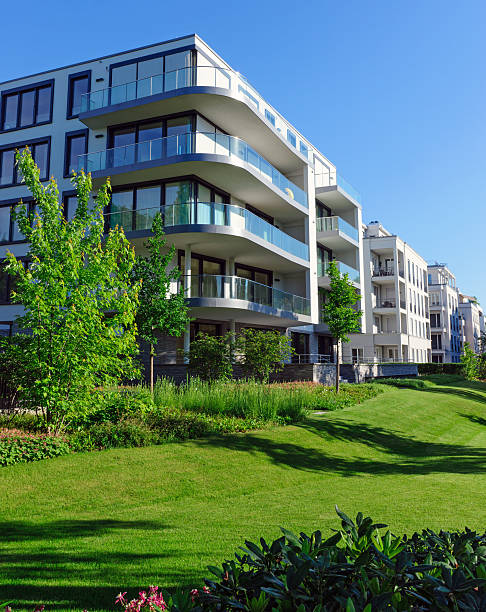istock Apartment houses and green grass 185983984