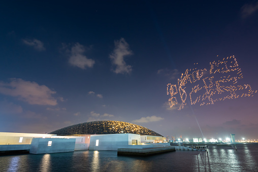 Abu Dhabi, UAE-Dec, 1 2023:  night drone show in Abu Dhabi city