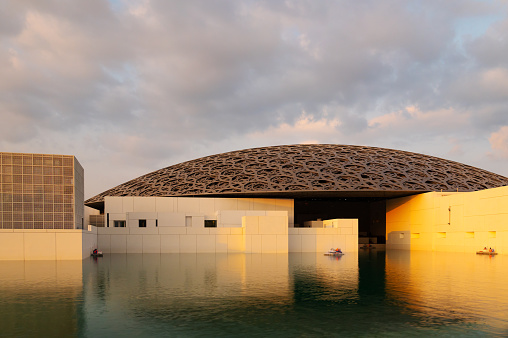 Abu Dhabi, UAE-Nov, 25 2023:  sunset in Louvre Museum, beautiful clouds.