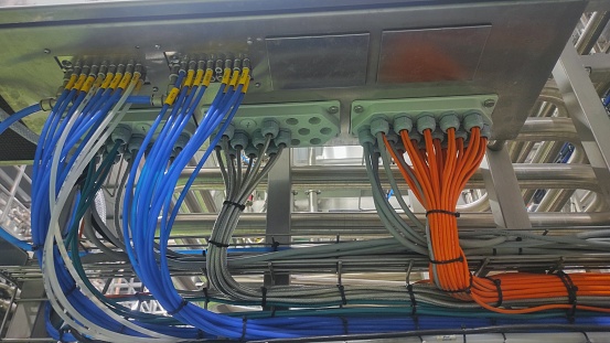 A bundle of colorful cable in production room of factory