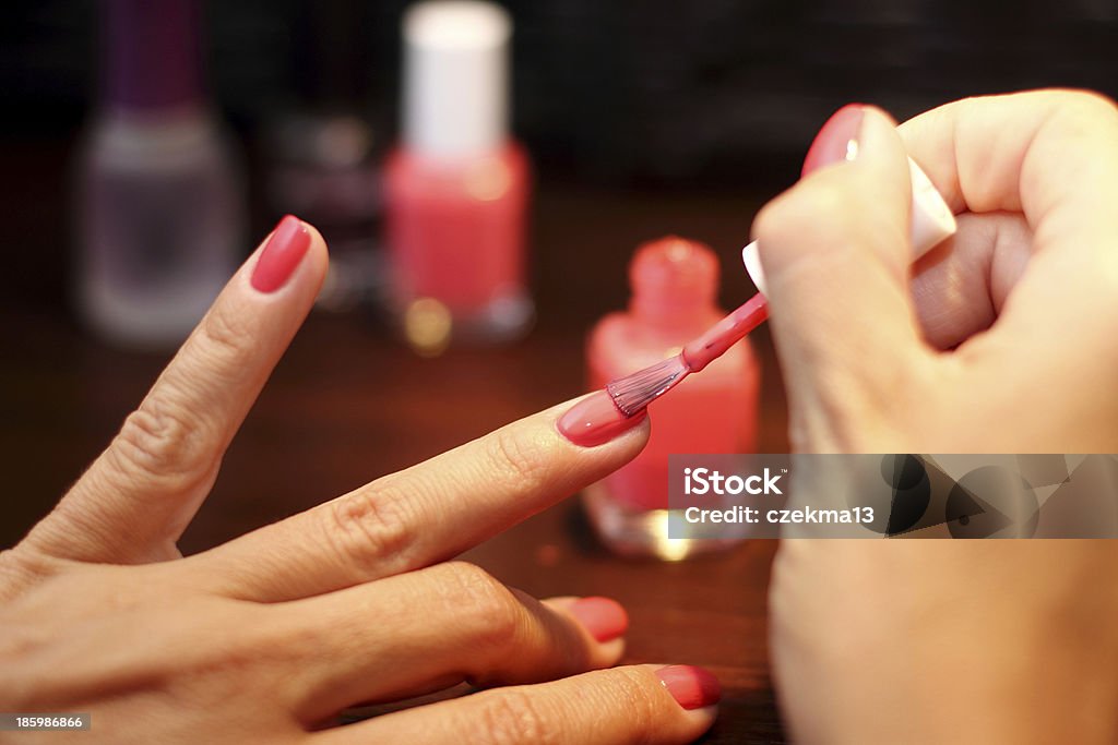 Finger nails painting Painting finger nails in red Painting Fingernails Stock Photo