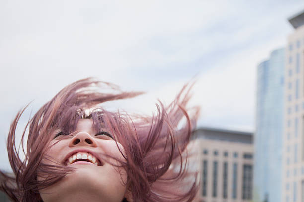 istock Young woman with hair blowing 185987437