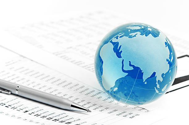 istock Glass globe and pen on finance 185987864