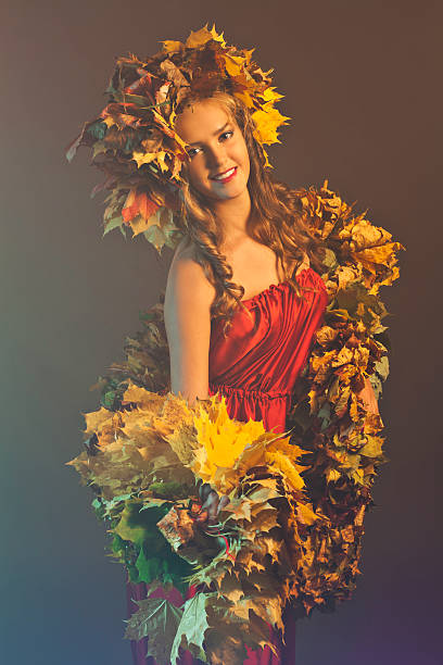 istock young woman with yellow leaves 185988813