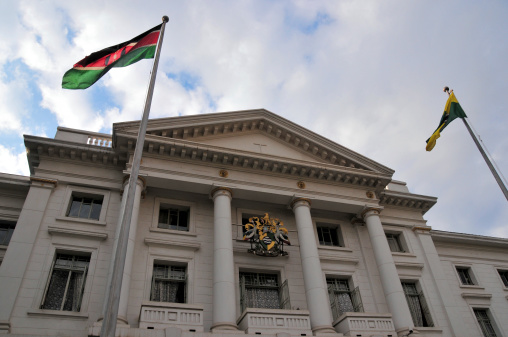 Nairobi, Kenya: neo-classical facade of the City Hall - flags of Kenya and Nairobi - photo by M.Torres