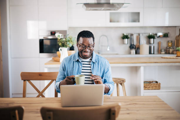 istock Portrait of a cheerful man having video call on laptop computer 1859893892