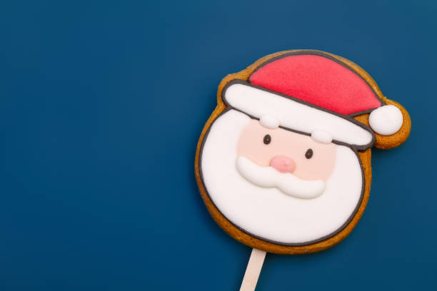 istock Santa Claus Gingerbread Cookie Pop on blue background 1859918705